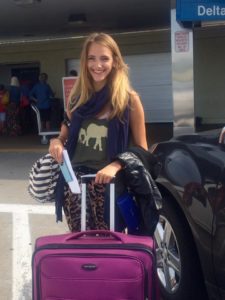 AIFS Abroad student at the airport with suitcase