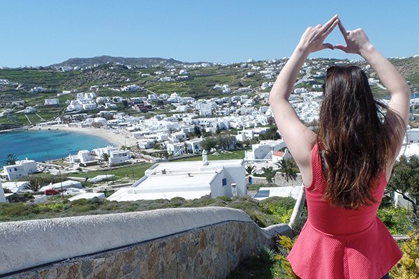 AIFS Abroad student in Greece making sorority sign with hands