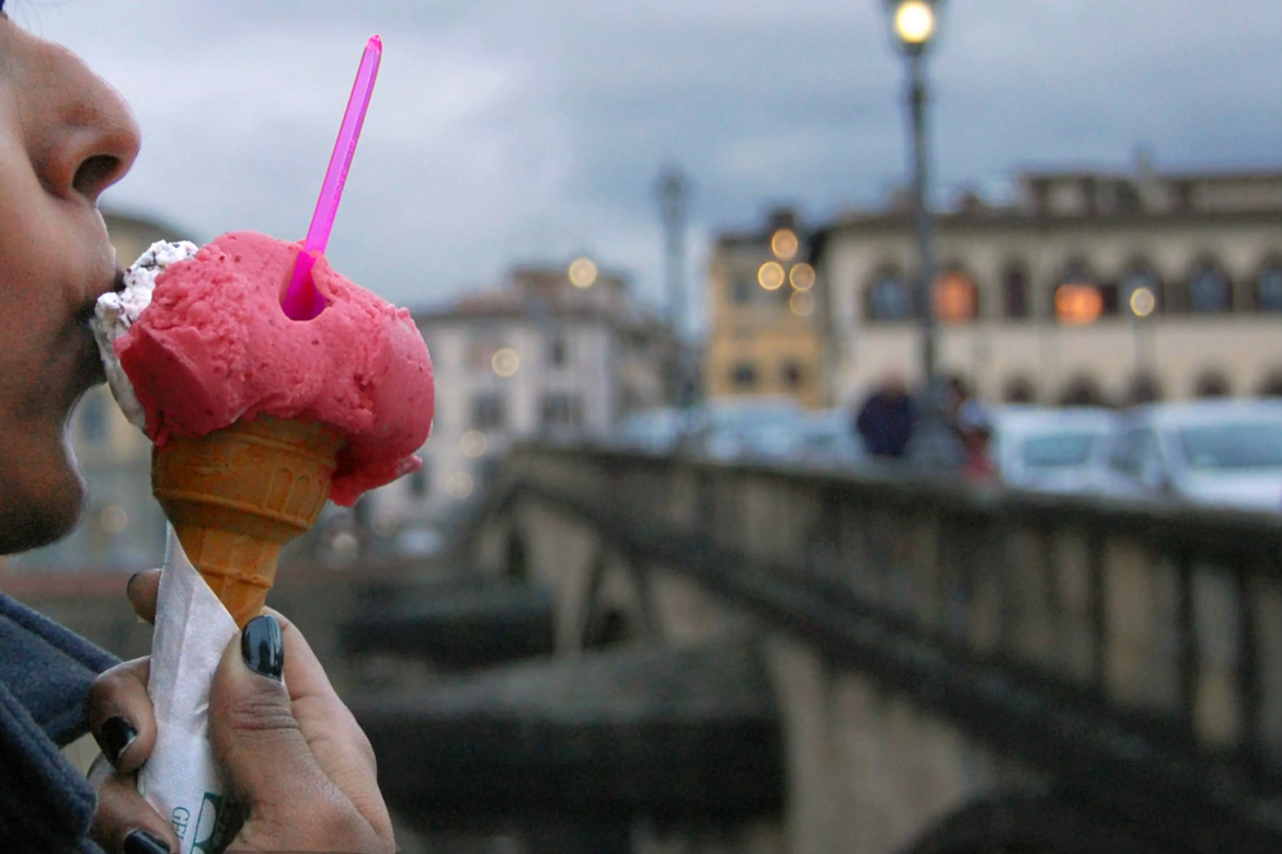 girl studying abroad eats gelato in florence, italy