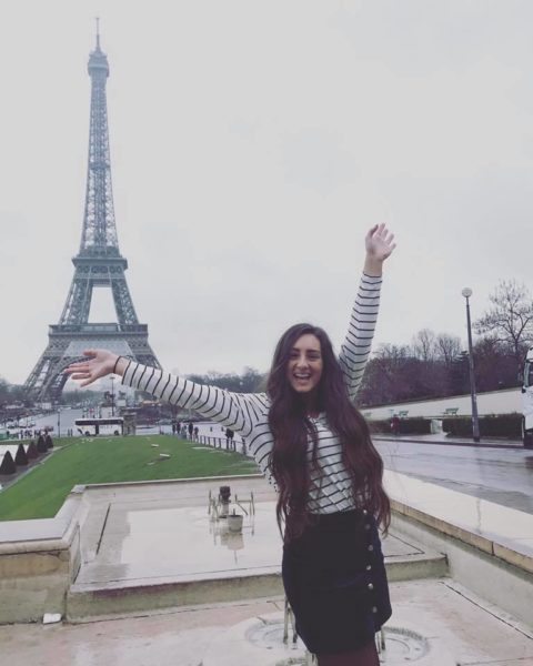 AIFS Abroad student in front of the Eiffel Tower in Paris, France