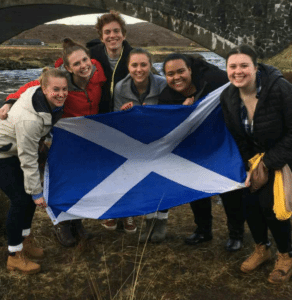 Students holding scotland flag