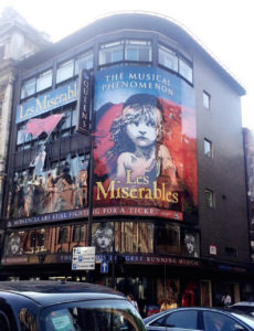 Les Miserables billboard in London's West End theater district