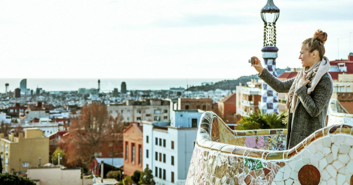 Young woman traveling in Barcelona and documenting her experience