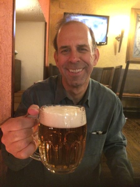 Student's dad having a pint while visiting prague