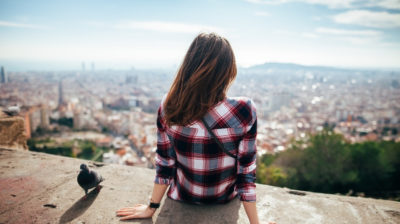 Young woman overlooking city of Barcelona, Spain