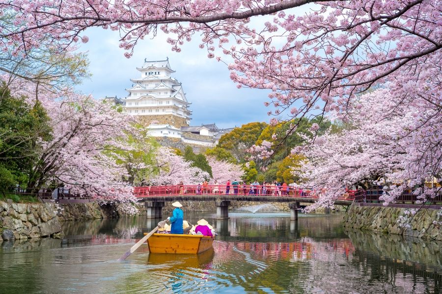People on boat floating down river in Japan | AIFS Study Abroad Study & Travel (Multi-Destination) – Japanese Culture: Past, Present and Future