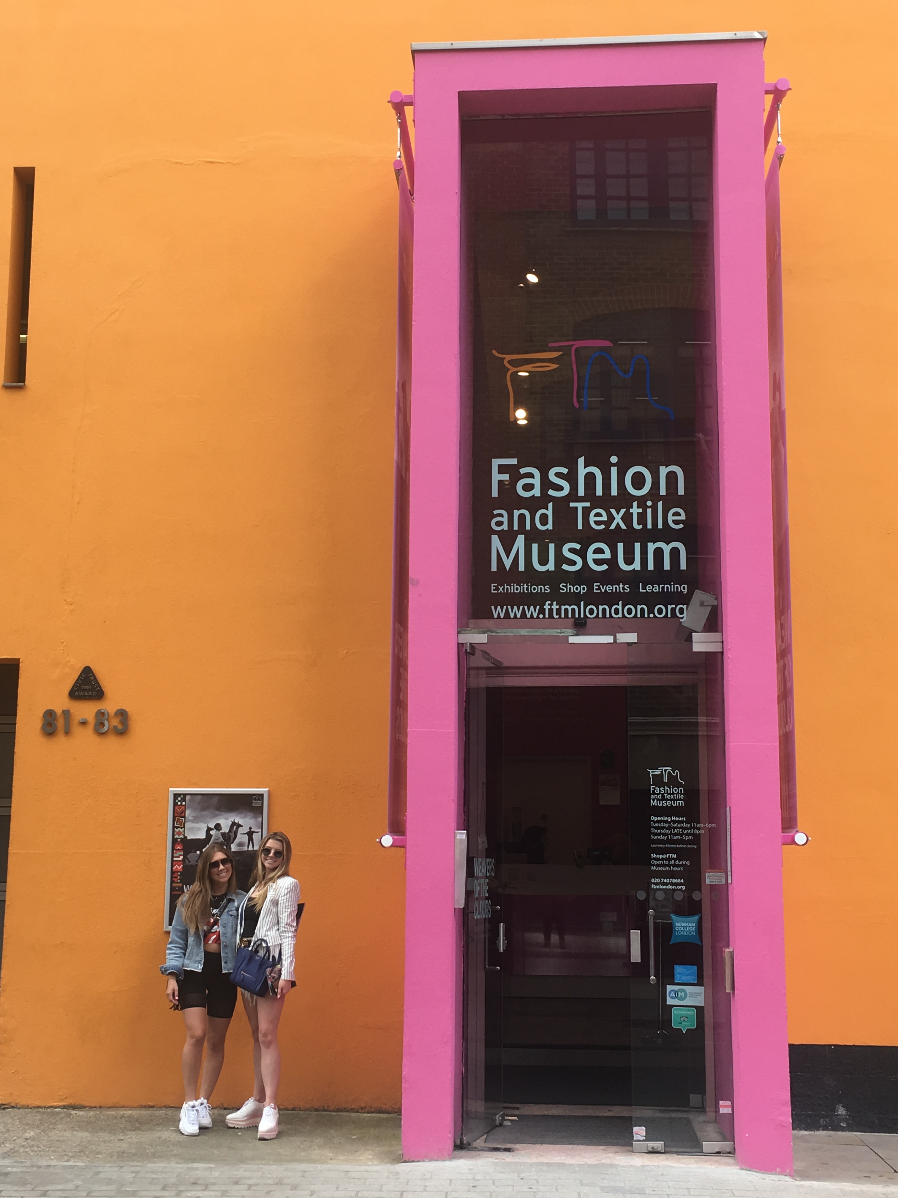 college students studying abroad and in front of fashion textile museum