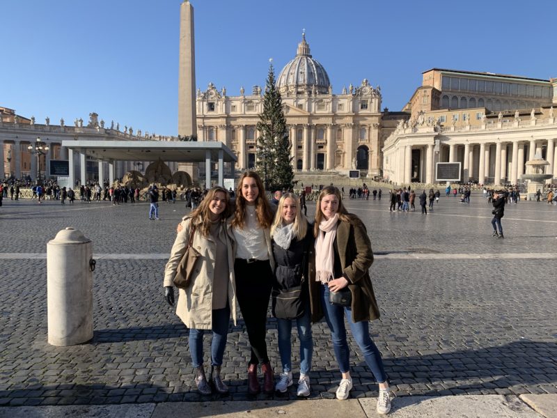 Group of study abroad students in front of St. Peter's Basilica at the Vatican in Rome, Italy