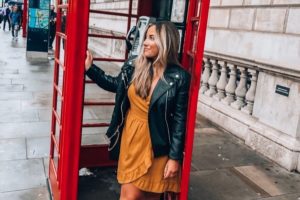 College student in London phonebooth | AIFS Study Abroad