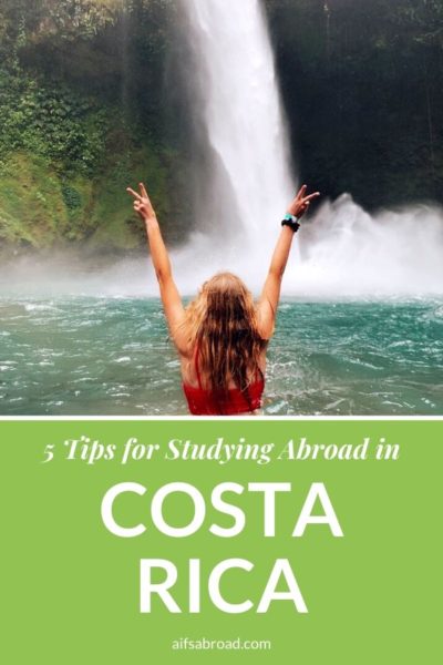 College student at waterfall in Costa Rica | AIFS Study Abroad