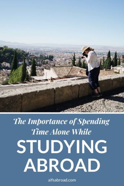 College student taking a photo alone in Granada, Spain | AIFS Study Abroad