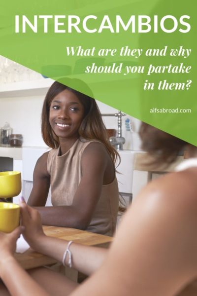 Young people sit at table having a conversation | AIFS Study Abroad