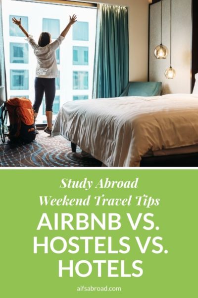 Traveler in a hotel room | Deciding between an Airbnb, hostel, or hotel as a student traveling | AIFS Study Abroad