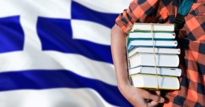 Book and Greek flag | AIFS Study Abroad