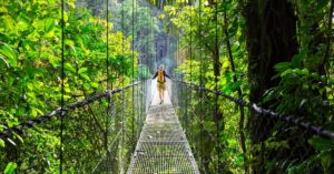 Young person walking across a bridge in Costa Rica | AIFS Study Abroad