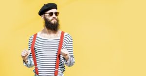 Man in French beret, striped shirt, and suspenders. | AIFS Study Abroad