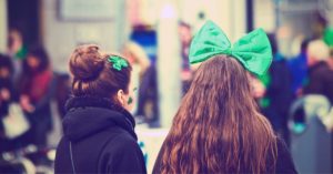 Young women at a St. Patrick's Day parade | AIFS Study Abroad