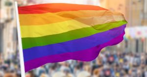 Gay flag at Pride Parade for Pride month | AIFS Study Abroad
