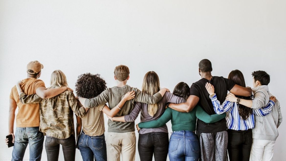 Group of diverse friends linking arms | AIFS Abroad