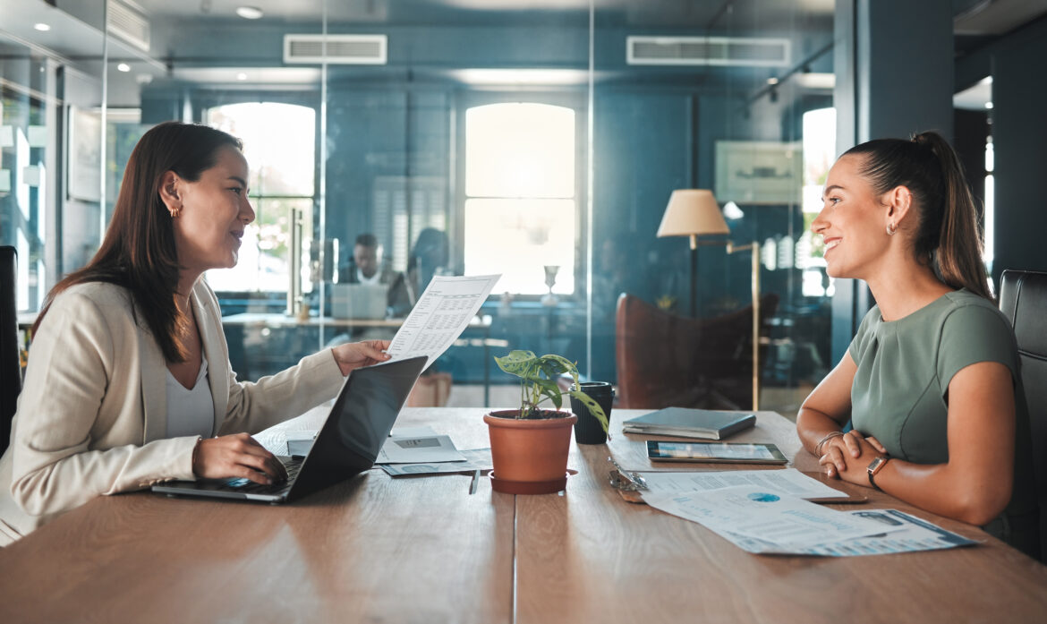 Young female applicant or candidate in a meeting with an employer having a discussion