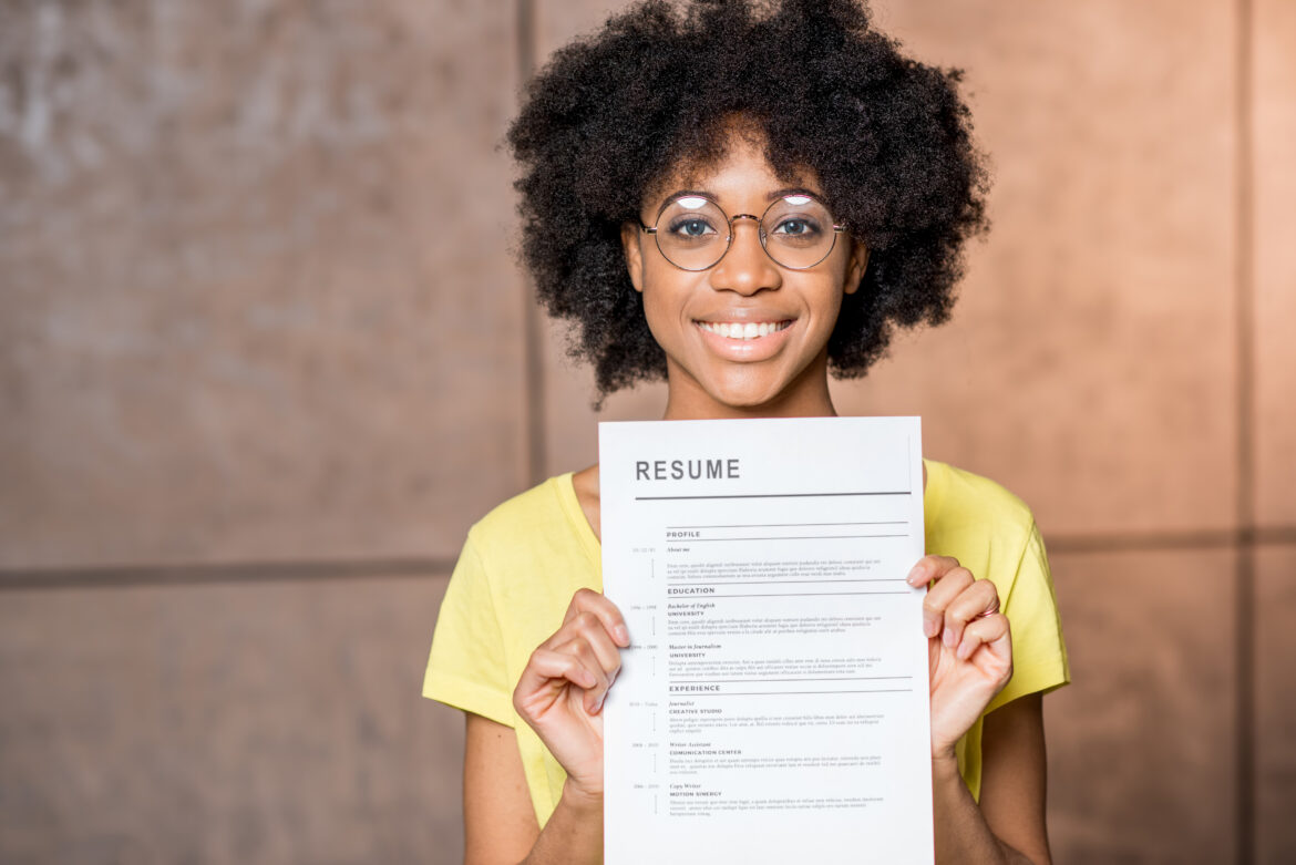 young woman holding resume