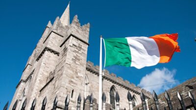 Irish flag in Dublin, Ireland in front of St. Patrick's Cathedral