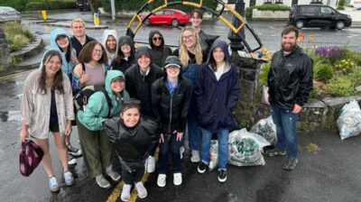 AIFS Abroad internship program participants in Galway, Ireland doing a beach-clean up for a sustainability project abroad