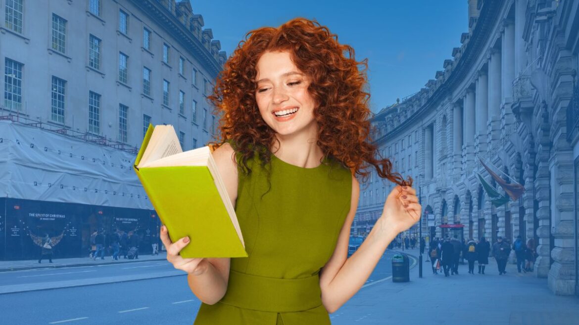 Bibliotherapy theme: Young woman happily reading a book in front of the streets of London, England