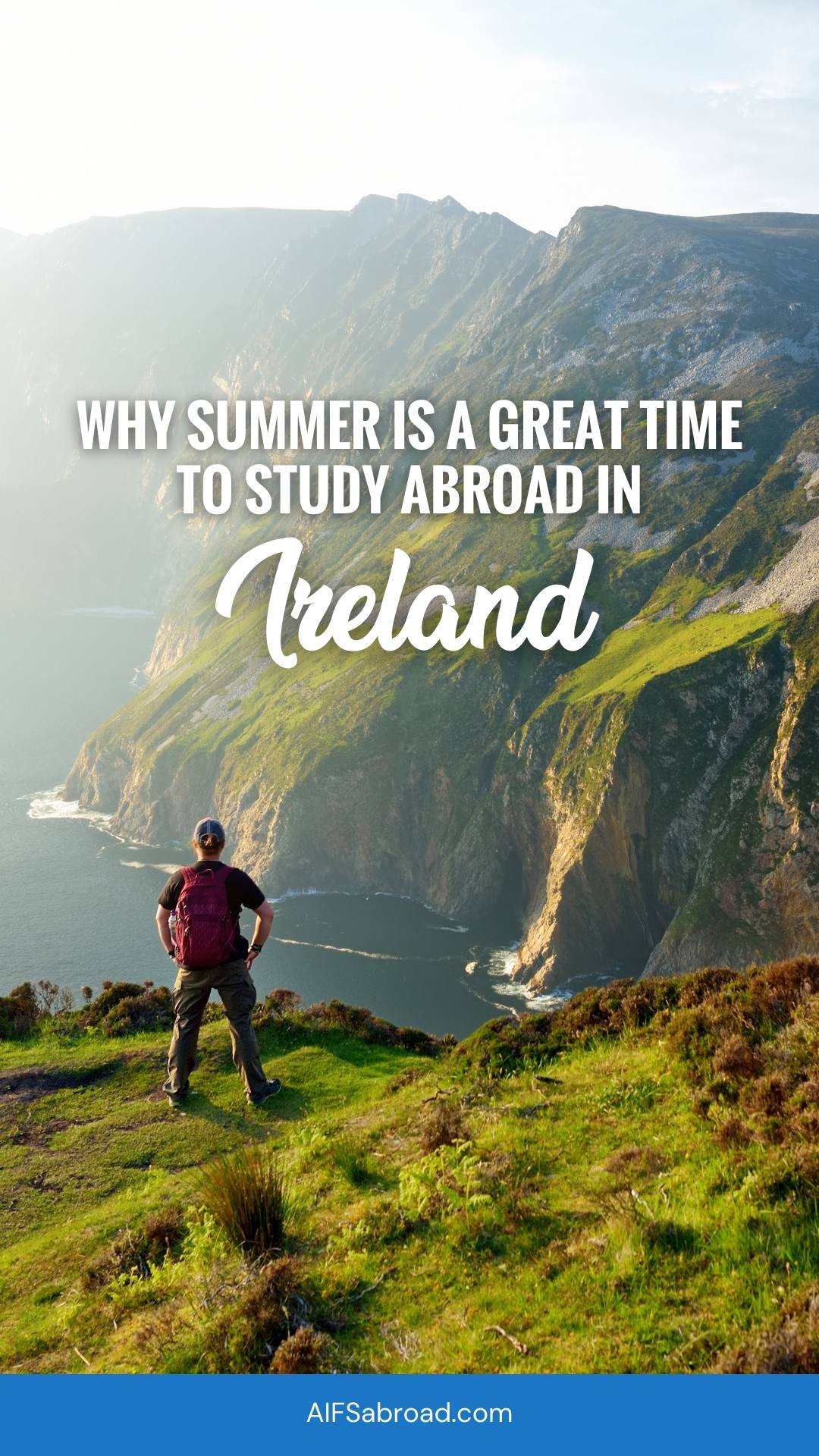 Young man on lush green high sea cliffs with text overlay, "Why summer is a great time to study abroad in Ireland"