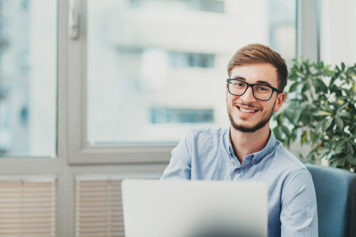 Young intern woking on laptop