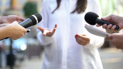 person and two microphones