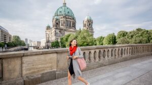 Young woman traveling and walking alone in Berlin, Germany