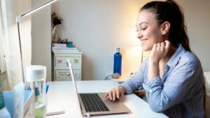 Young woman at laptop for virtual internship