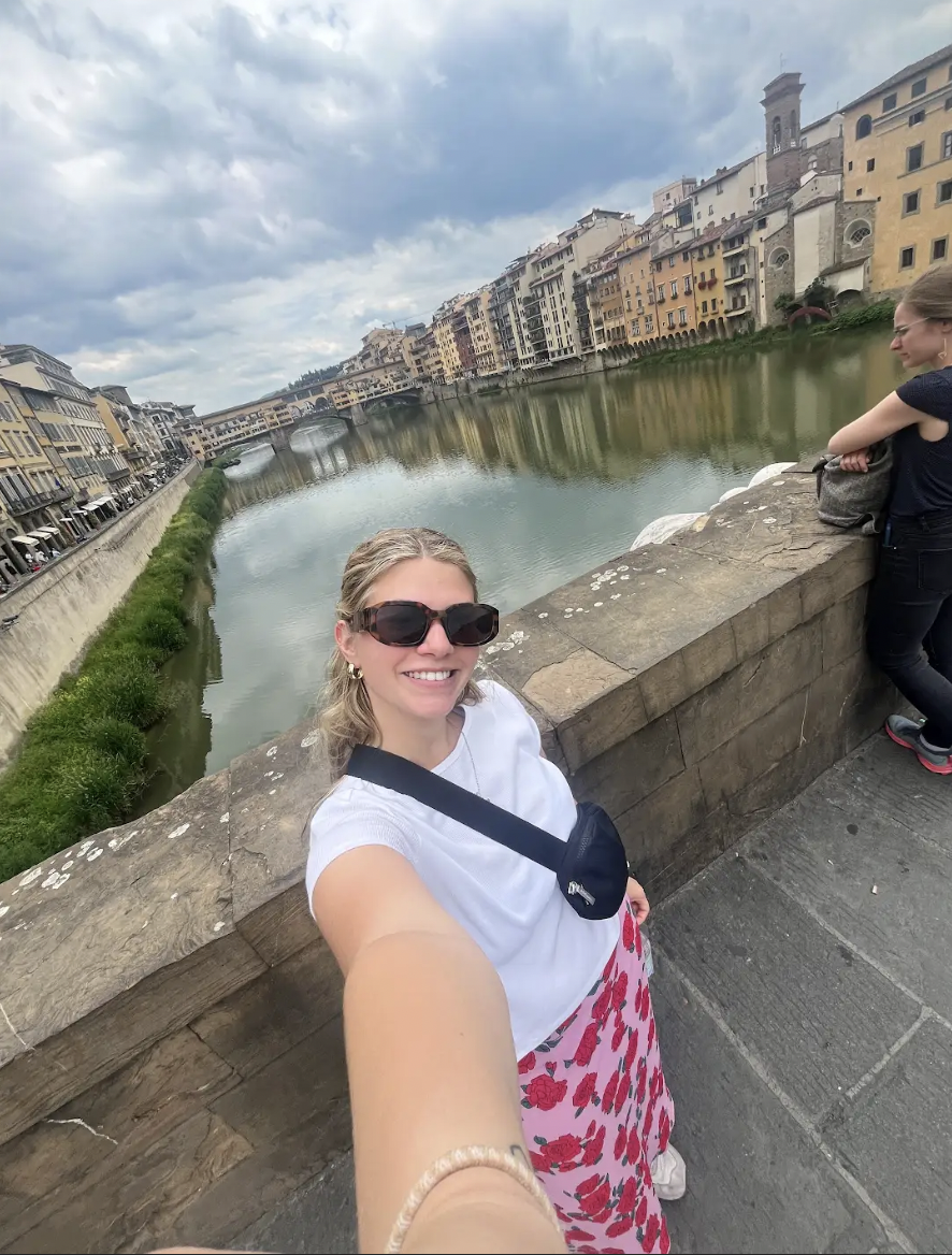 aifs abroad student  at the Arno River with a view of the Ponte Vecchio in Florence, Italy