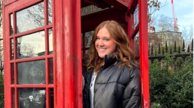 aifs abroad student at red phone booth in london, england