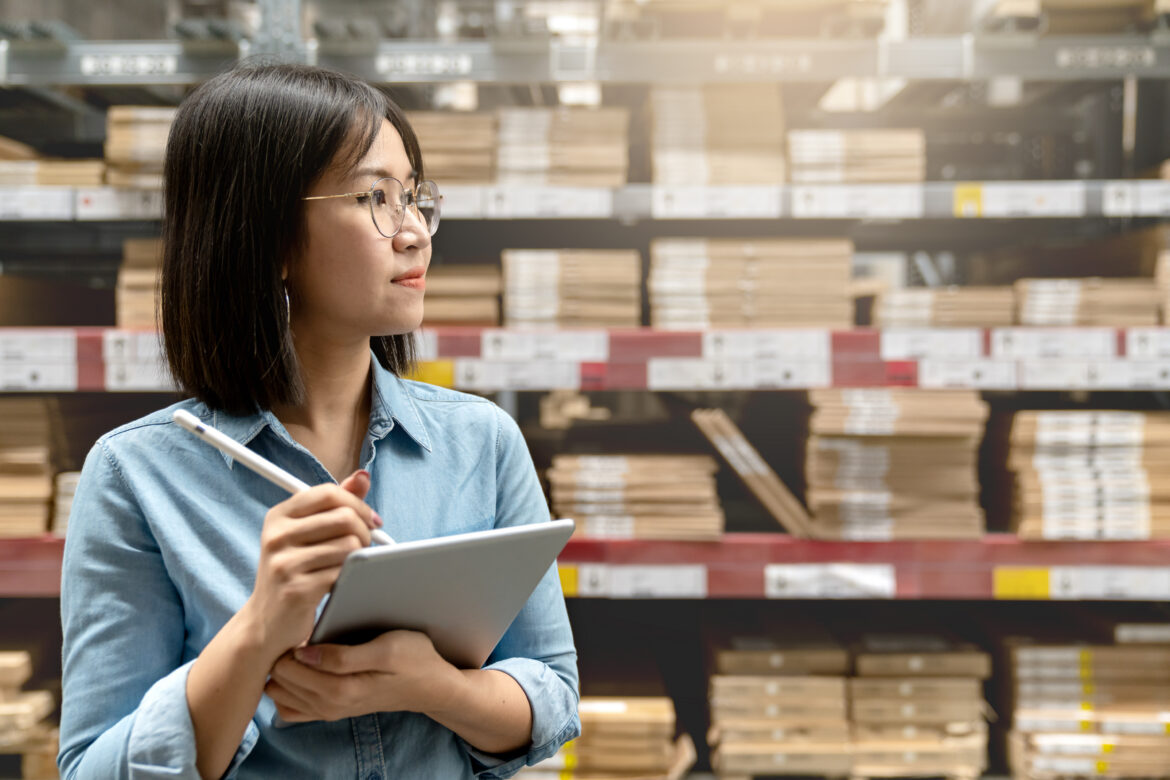 woman holding smart tablet computer with efulfillment service business warehouse management