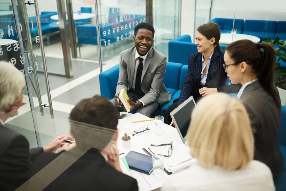 group of business people discussing project during meeting