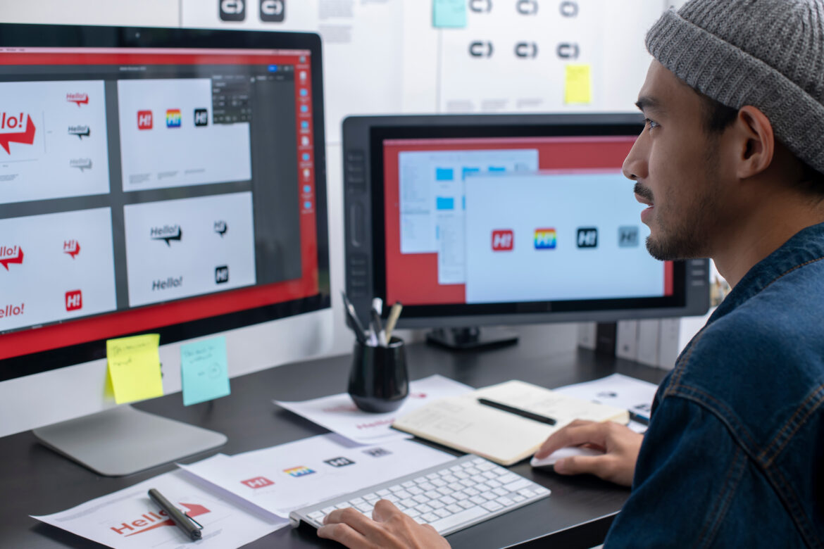 graphic designer working on computer drawing sketches logo design. The concept of a new brand. Professional creative occupation with idea.