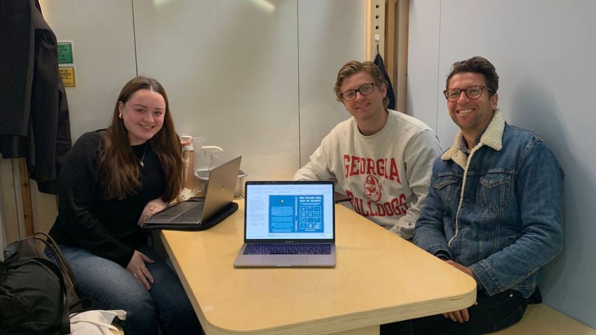 Three interns abroad at the office.