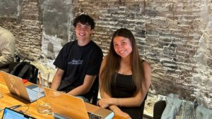 two interns abroad in an office environment