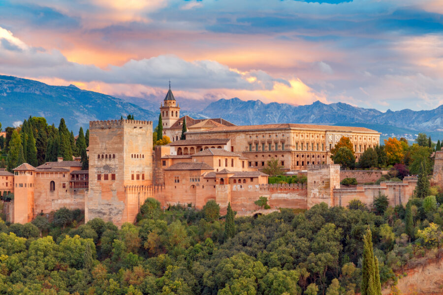  Walls and towers of the fortress of the Alhambra at sunset in Granada. Andalusia. Spain.